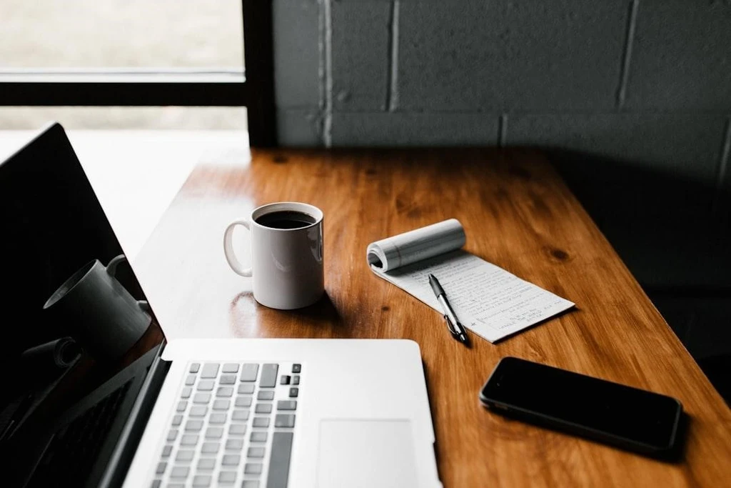 Email Scheduling Tips with laptop and notes