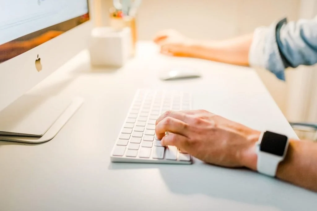 An image of a person working on his computer
