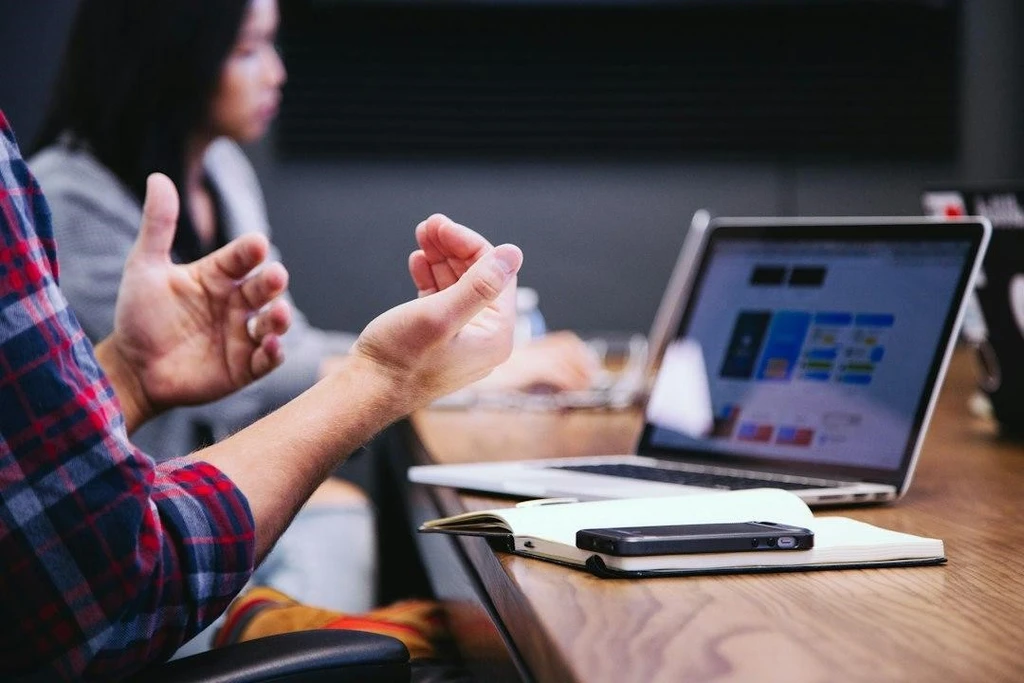 A person explaining in the meeting