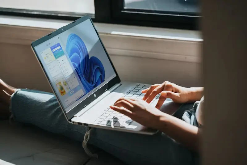 Working using a laptop beside the window